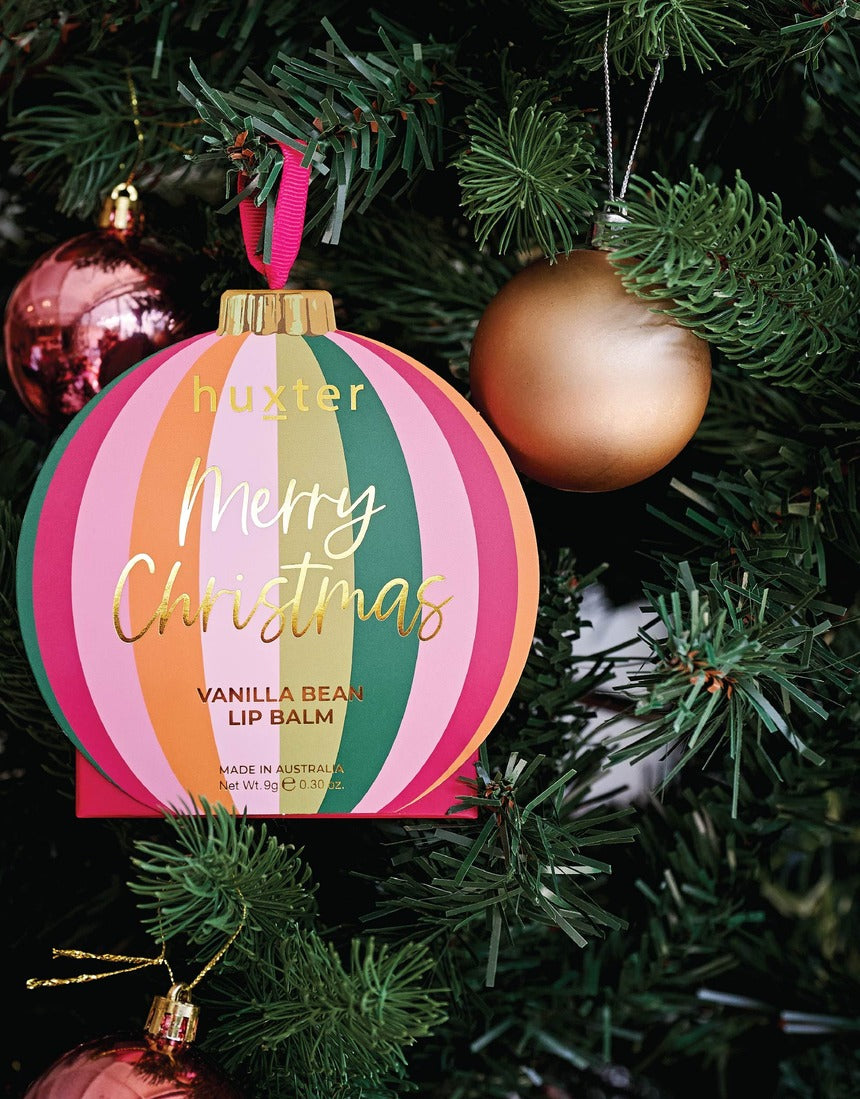 Huxter Mulberry Hanging Lip Balm on a Christmas tree