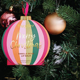 Huxter Mulberry Hanging Lip Balm on a Christmas tree