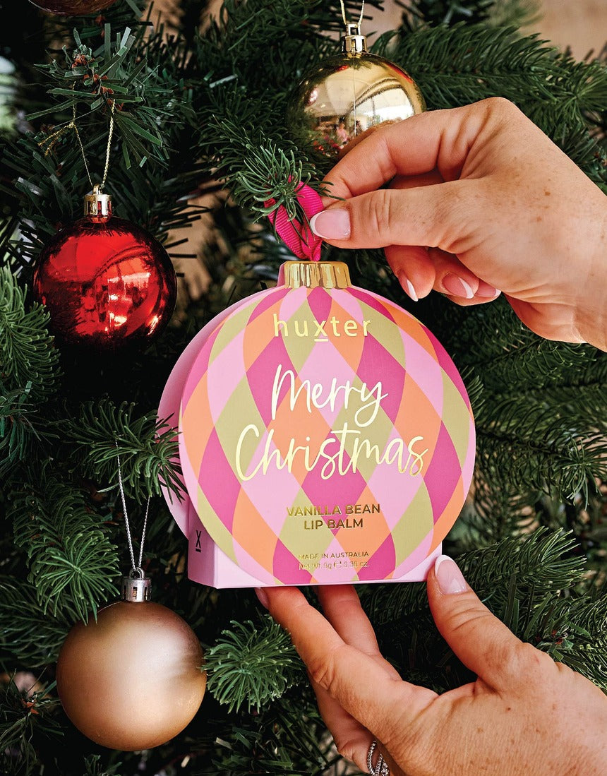 Huxter Soft Pink Hanging Lip Balm on a Christmas tree