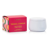 Huxter Adorned Christmas travel candle with pink pepper and vanilla bean scent, featuring festive holiday packaging.