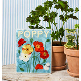 Jones & Co Market Wall Art featuring vibrant poppy flower illustration on a neutral background, perfect for home decor.