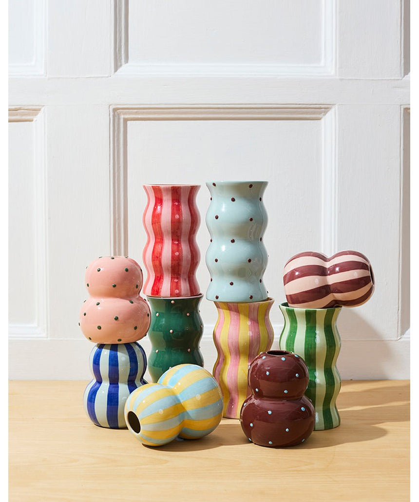 Jones & Co Fonda Vase in pink and green dotty pattern, showcasing a stylish ceramic design with a rounded shape.