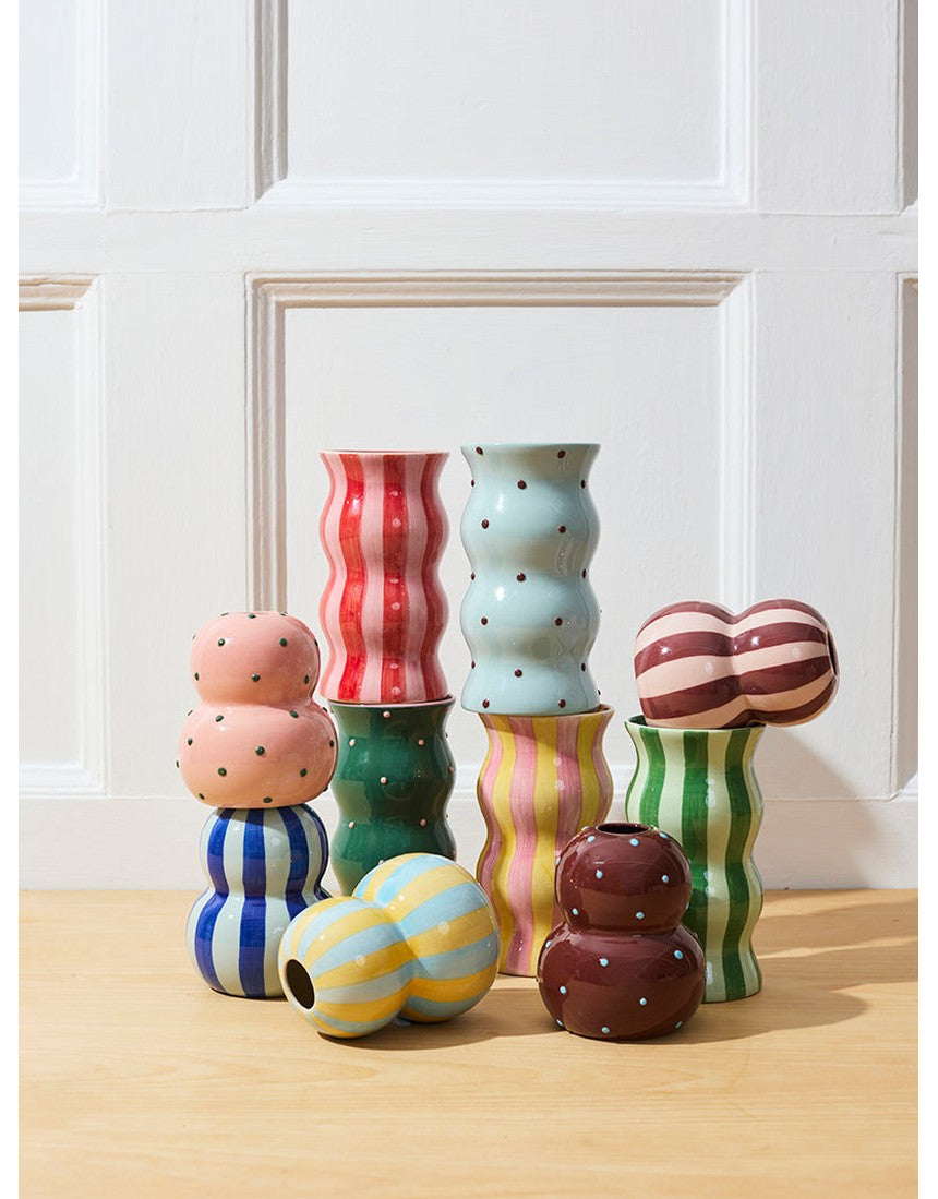 Jones & Co Fonda Vase in pink and green dotty pattern, showcasing a stylish ceramic design with a rounded shape.