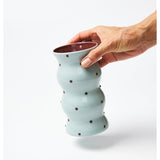 Jones & Co Palma Vase in blue and brown with a dotty pattern, showcasing its stylish ceramic design and vibrant colors.