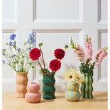 Jones & Co Palma Vase in green with pink dotty pattern, showcasing a stylish ceramic vase with a vibrant, playful design.
