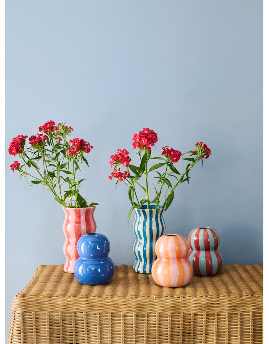 Jones & Co Palma Vase with red and pink striped design, showcasing a glossy ceramic finish and elegant shape.