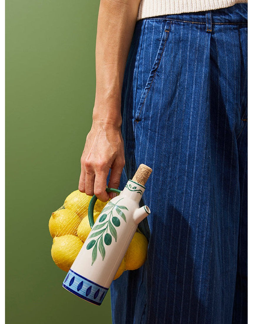 Jones & Co Piccolo Vita Oil Pourer, a sleek glass tableware oil dispenser with a stainless steel spout for easy pouring.