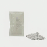 Kind Bod Shower Spells shower bomb with calming Zen scent, shown in a clear container with colorful bath tablet.