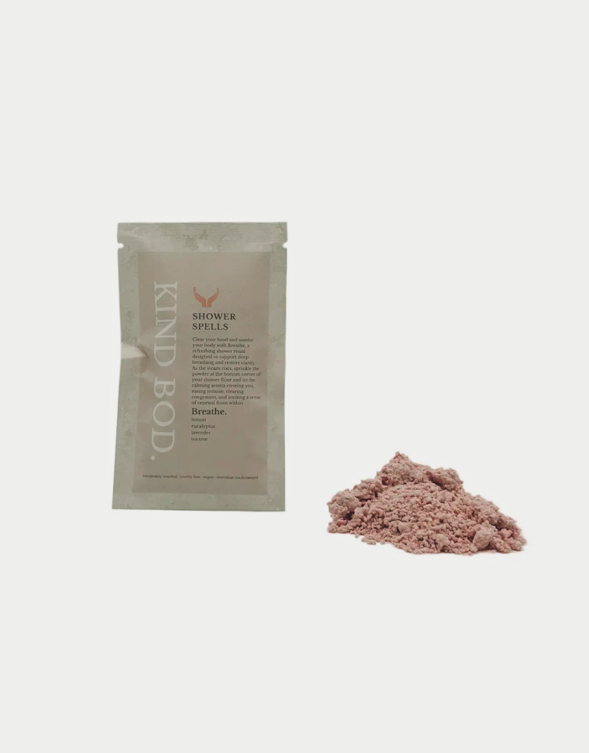 Kind Bod Shower Spells shower bomb with calming Zen scent, displayed in a clear container with colorful packaging.