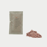 Kind Bod Shower Spells shower bomb with calming Zen scent, displayed in a clear container with colorful packaging.