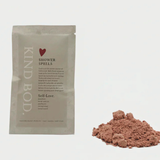 Kind Bod Shower Spells shower bomb dissolving in water, showcasing a colorful, calming bath product designed for relaxation.