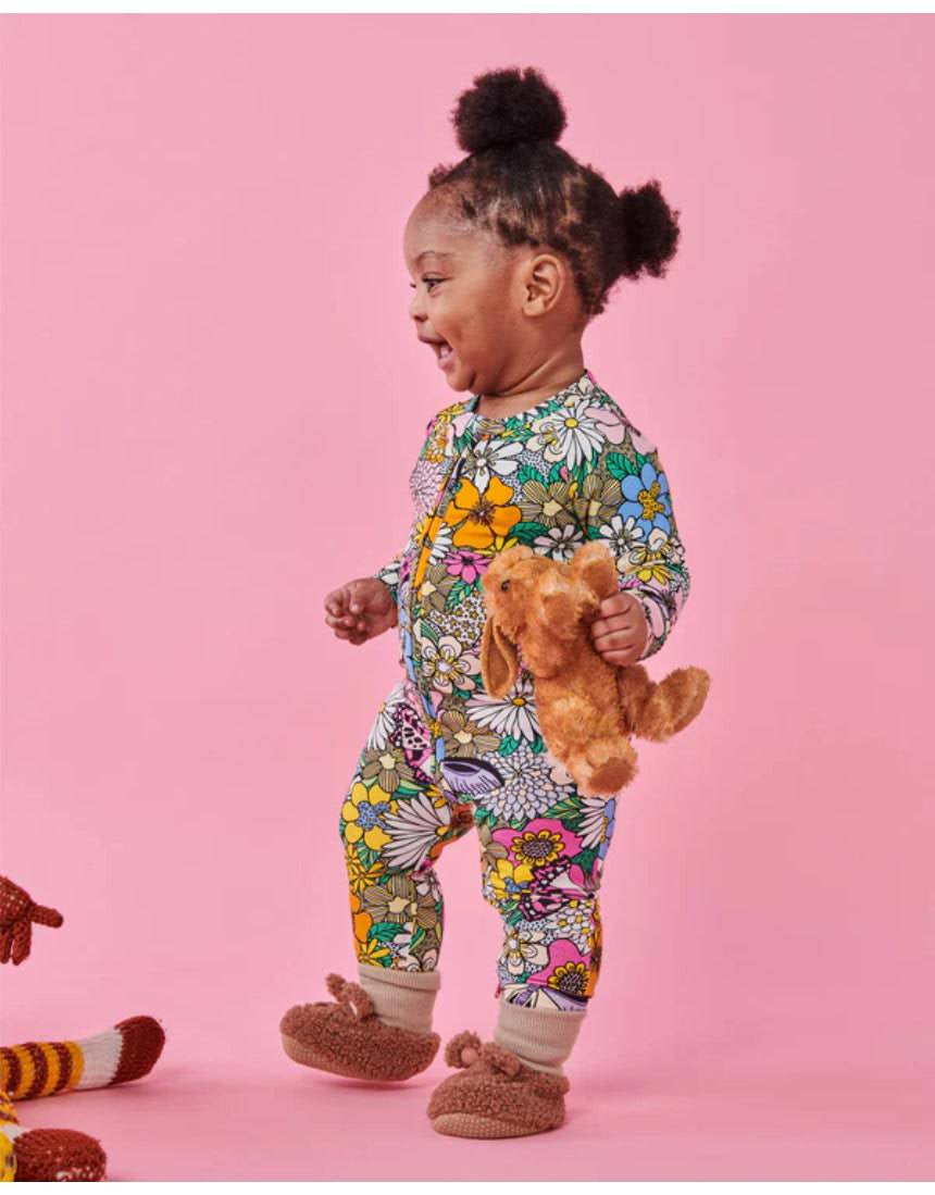 Kip & Co Bliss Floral organic long sleeve zip romper for babies, featuring colorful floral patterns and soft fabric.