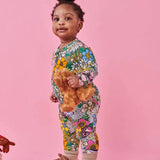 Kip & Co Bliss Floral organic long sleeve zip romper for babies, featuring colorful floral print and soft fabric.