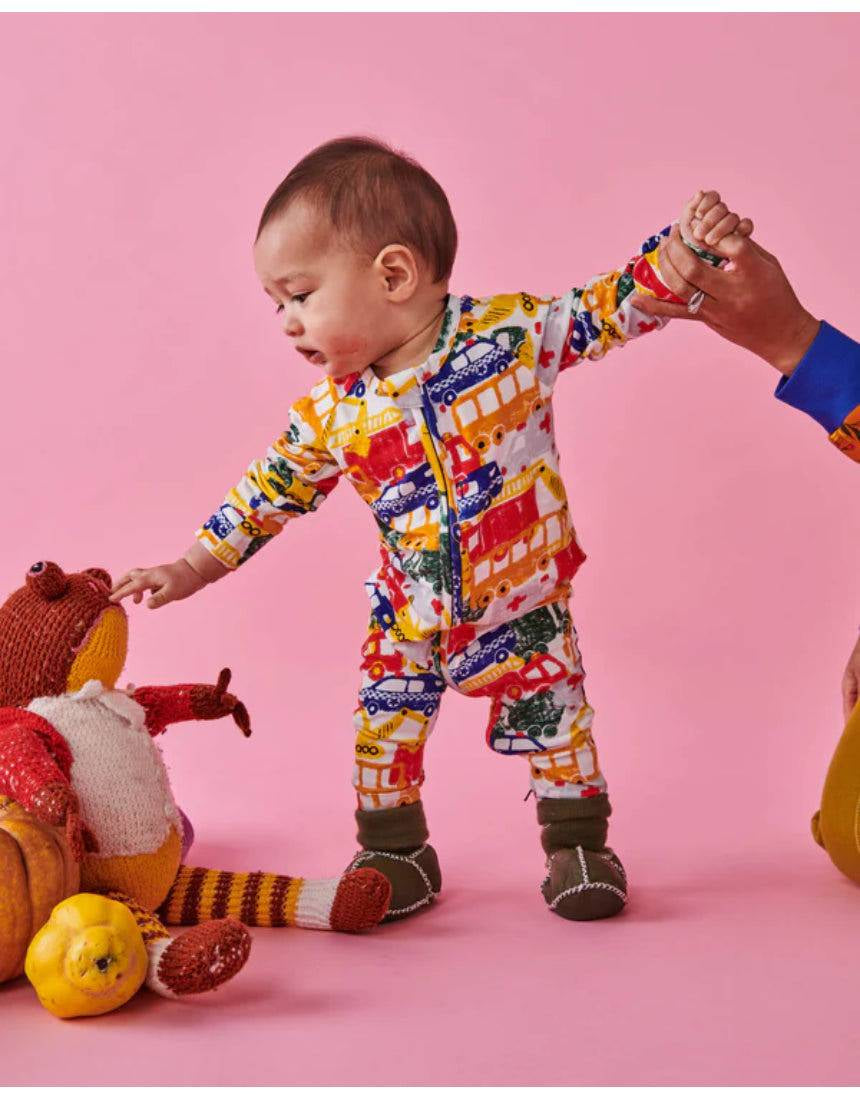 Kip & Co Big Wheels organic long sleeve zip romper for babies in playful wheel pattern, soft and comfy baby clothing.