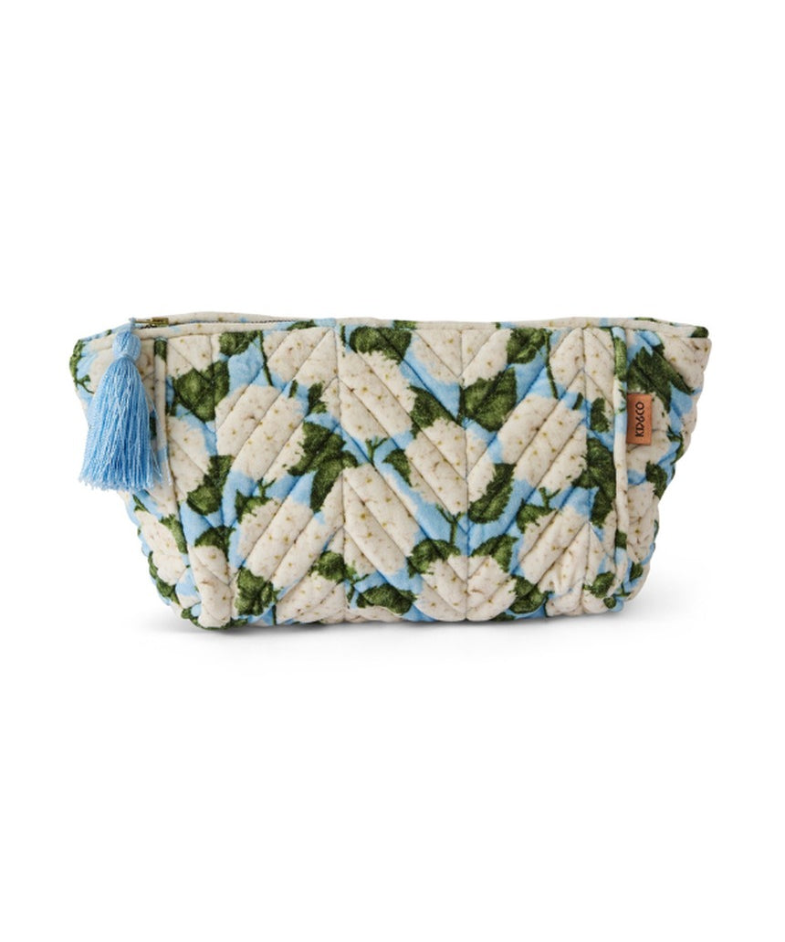 Kip&Co velvet toiletry bag in Hydrangea Blue with a soft, plush texture and floral pattern, ideal for travel organization.