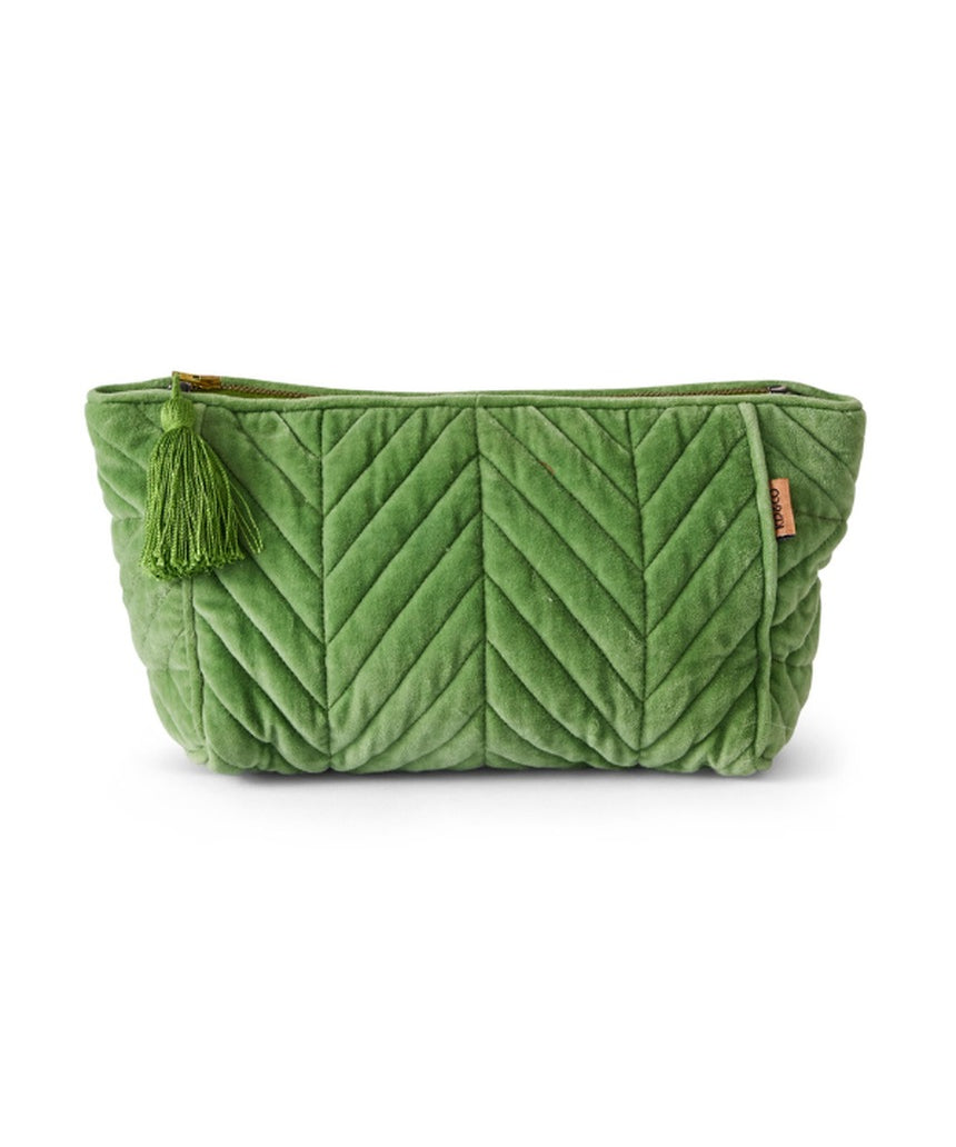 Kip&Co velvet toiletry bag in Pesto color with soft texture and zipper closure, designed for travel and storage.