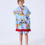 Kip&Co kids' printed terry poncho with nautical Hey Sailor design, featuring soft fabric and colorful sailor-themed pattern.