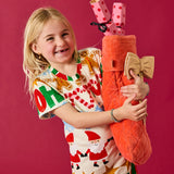Kip & Co golden bow velvet Christmas stocking hanging as festive holiday decoration