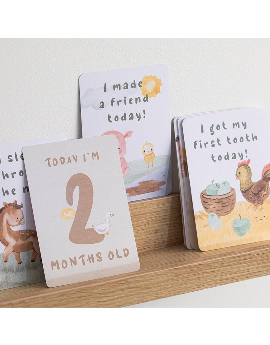 Living Textiles Baby Milestone Cards featuring a tractor ride design, ideal for capturing baby's special moments.