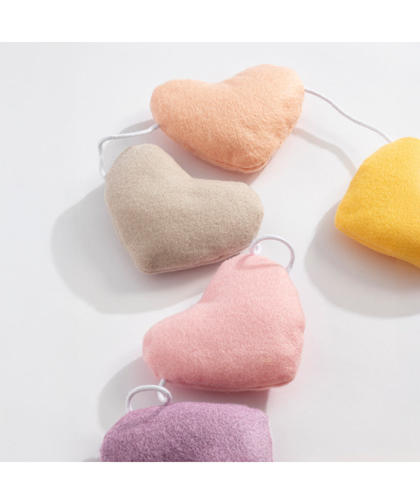 Living Textiles Felt Heart Bunting in Bohemian Bliss nursery decor, colorful felt hearts hanging as playful wall decoration