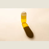 Maho Happi Pill glassware with fried egg design, clear glass container featuring a colorful fried egg illustration.