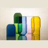 Maho Happi Pill Fried Egg glassware featuring a yellow fried egg design on clear glass with colorful accents.