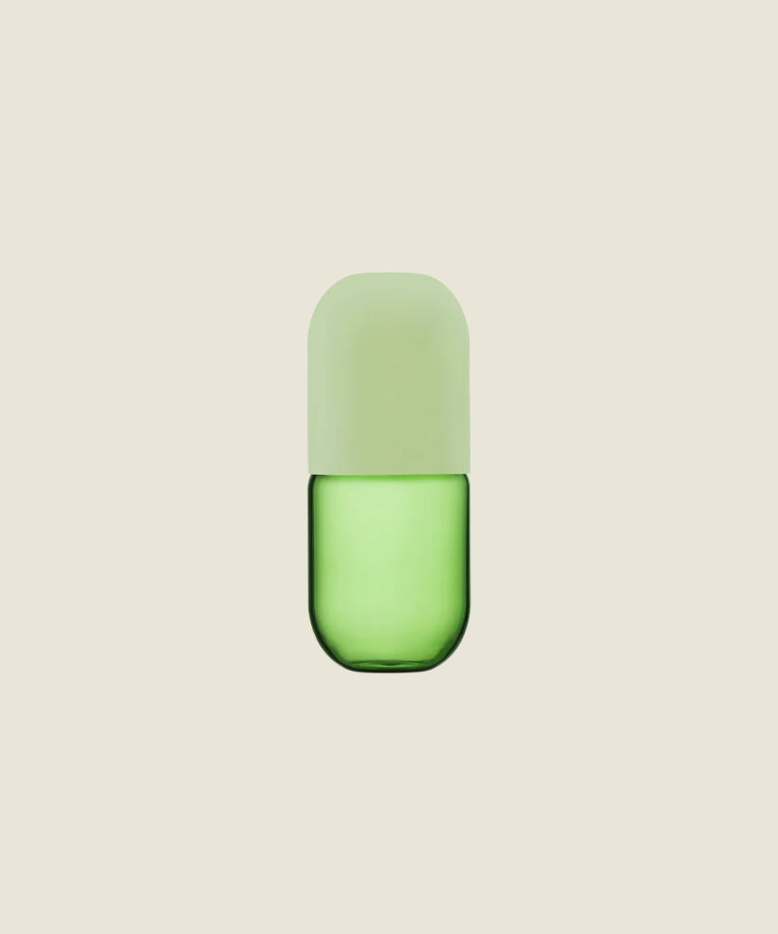 Maho Happi Pill glassware in avocado color, featuring a sleek, rounded design, perfect for stylish drink presentation.