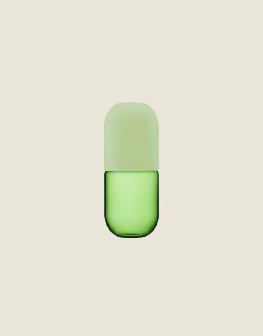 Maho Happi Pill glassware in avocado color, featuring a sleek, rounded design, perfect for stylish drink presentation.