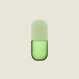 Maho Happi Pill glassware in avocado color, featuring a sleek, rounded design, perfect for stylish drink presentation.
