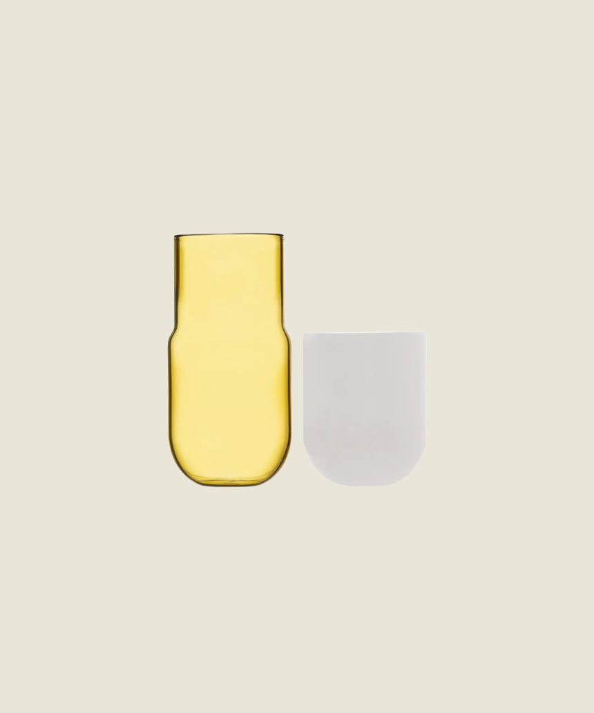 Maho Happi Pill glassware with fried egg design, disassembled, showcasing the playful, colorful ceramic piece and glass components.