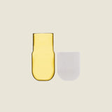 Maho Happi Pill glassware with fried egg design, disassembled, showcasing the playful, colorful ceramic piece and glass components.