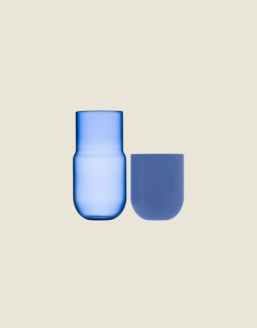 Maho Happi Pill glassware in blue, disassembled showing the colorful pill-shaped design and vibrant blue color.