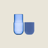 Maho Happi Pill glassware in blue, disassembled showing the colorful pill-shaped design and vibrant blue color.