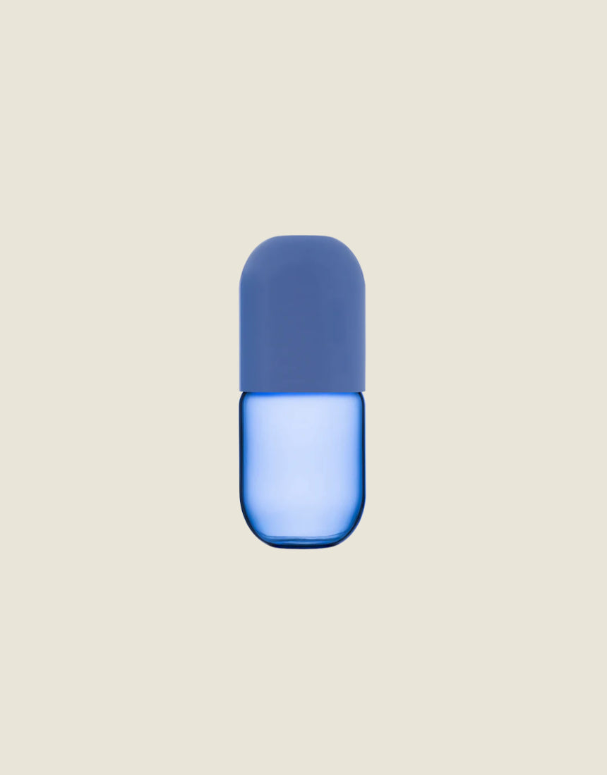 Maho Happi Pill glassware with blue design, featuring a pill-shaped tumbler with colorful blue patterns on clear glass.