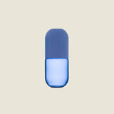 Maho Happi Pill glassware with blue design, featuring a pill-shaped tumbler with colorful blue patterns on clear glass.