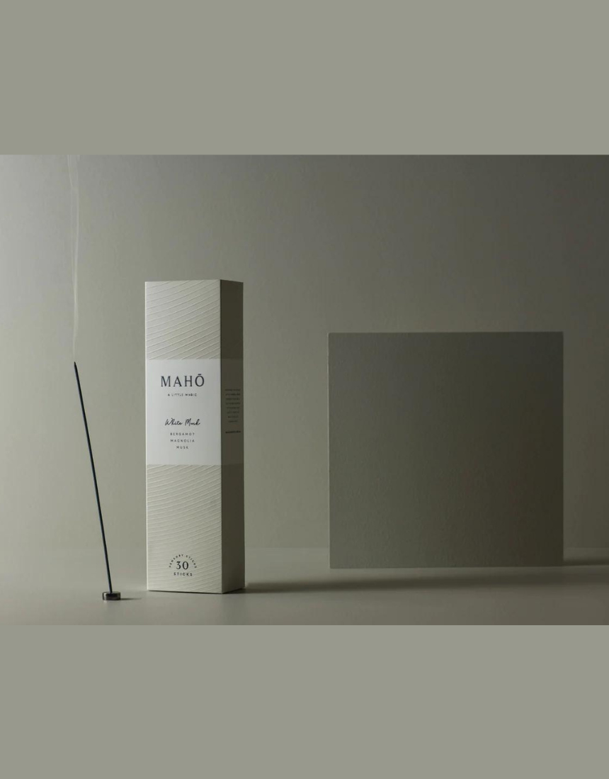 Maho White Musk Incense sticks in a box, with white packaging and scent description visible, designed for aromatic burning.