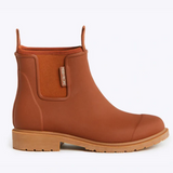 Rust-colored Merry People Bobbi Gumboot shoes with black soles and rounded toe, stylish waterproof footwear for women.