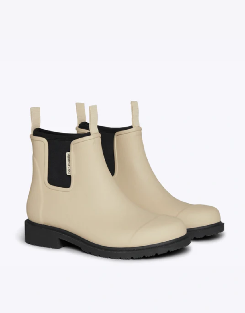 Merry People Bobbi Gumboot Sand shoes featuring durable rubber soles and stylish sand-colored waterproof design.