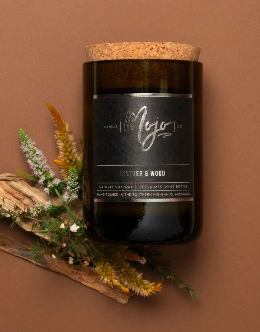 Leather and wood scented candle by Mojo Candle Co. from the Black Label collection, featuring a sleek black container.