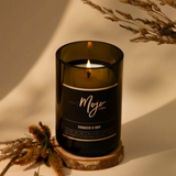 Mojo Candle Co. Tobacco & Hay Black Label candle with a sleek black container and rustic label design.