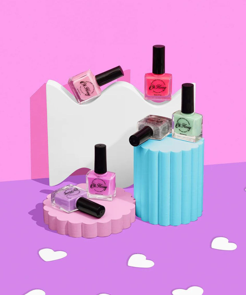 Kids nail polish by Oh Flossy in cream violet, featuring a colorful bottle with playful design and vibrant purple shade.