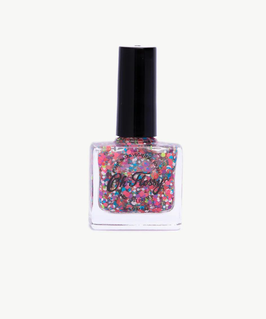 Kids nail polish by Oh Flossy in cream violet color, shown in a small bottle with a white cap and vibrant purple shade.
