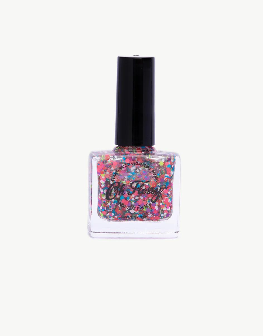 Kids nail polish by Oh Flossy in cream violet color, shown in a small bottle with a white cap and vibrant purple shade.