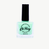 Kids Oh Flossy nail polish in cream violet, featuring a colorful bottle with playful label and vibrant purple nail color.