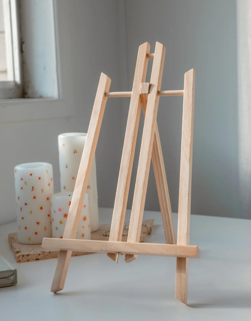 Paint Like Frida mini art easel with a paint by numbers canvas featuring a Frida Kahlo-inspired portrait displayed on the easel.