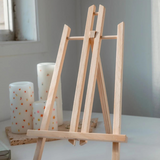 Paint Like Frida mini art easel with a paint by numbers canvas featuring a Frida Kahlo-inspired portrait displayed on the easel.