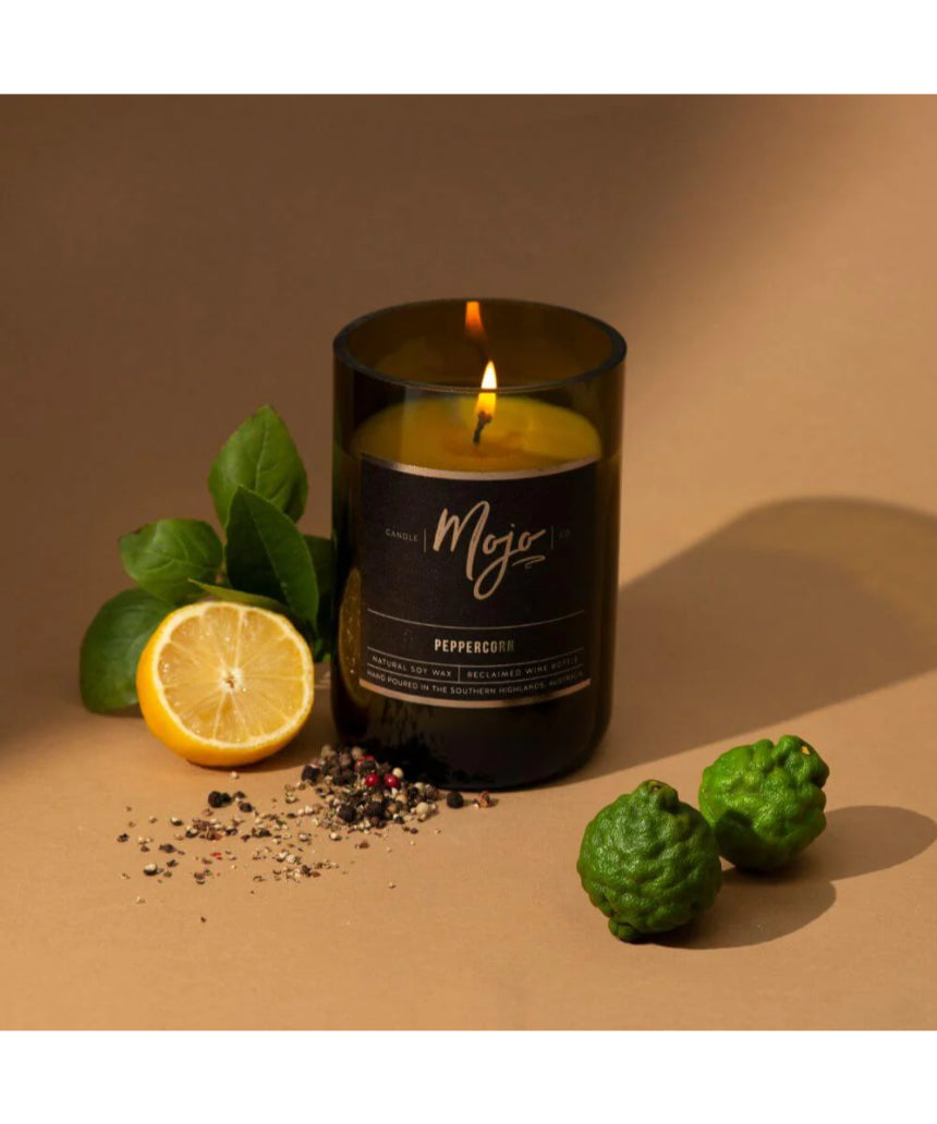 Peppercorn Black Label candle by Mojo Candle Co., in a wine bottle-shaped container with black label design.
