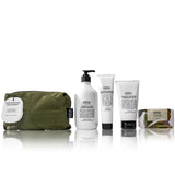 Salus Quintessential Skin Quartet skincare set with four products displayed in sleek packaging on a neutral background.