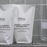 Salus Geranium & Juniper Berry Body Wash Refill 1L bottle with label showing natural ingredients and eco-friendly packaging.