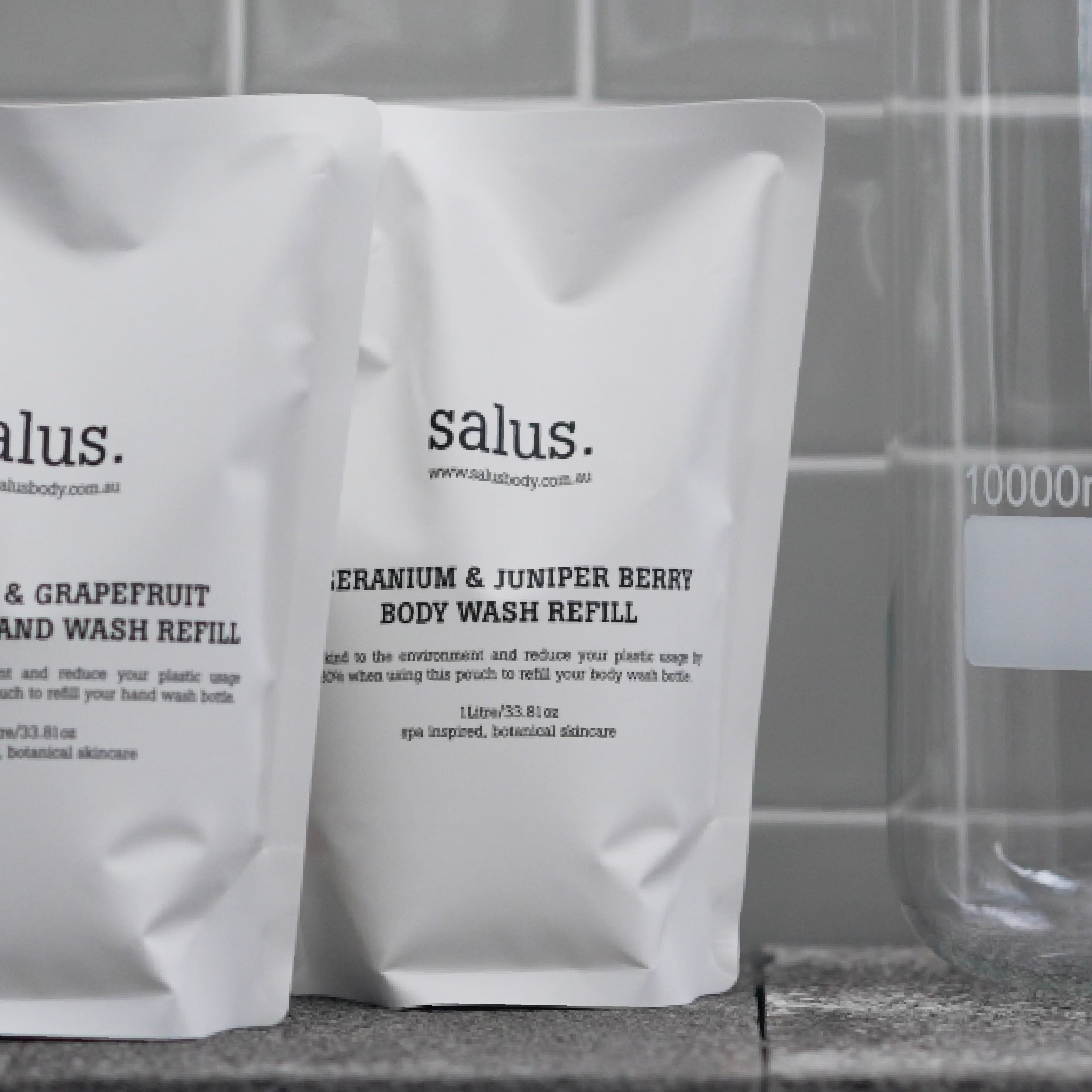 Salus Geranium & Juniper Berry Body Wash Refill 1L bottle with label showing natural ingredients and eco-friendly packaging.